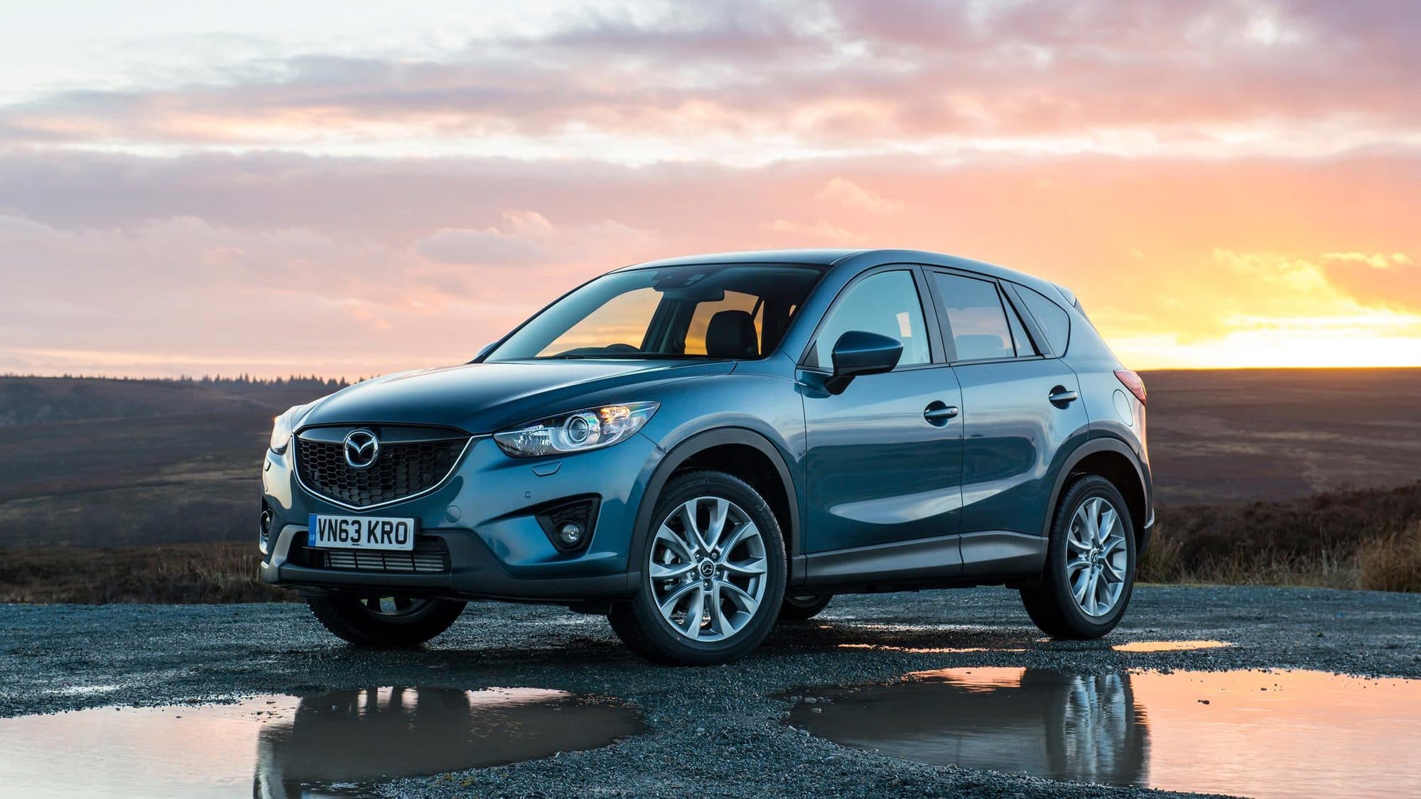 A car at sunset outside the showroom